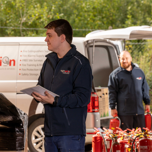 Fire alarm engineer checking stock